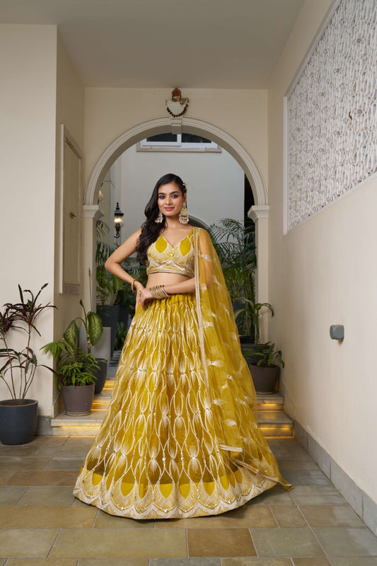 Yellow Thread Embroidery Lehenga Choli in Net